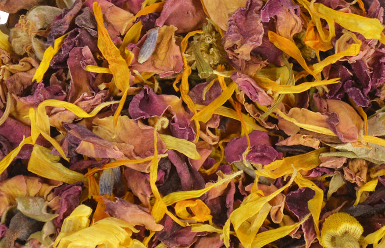 An image displaying a collection of bath tea herbs, showcasing a variety of dried botanicals and herbs used for a soothing and aromatic bath experience.