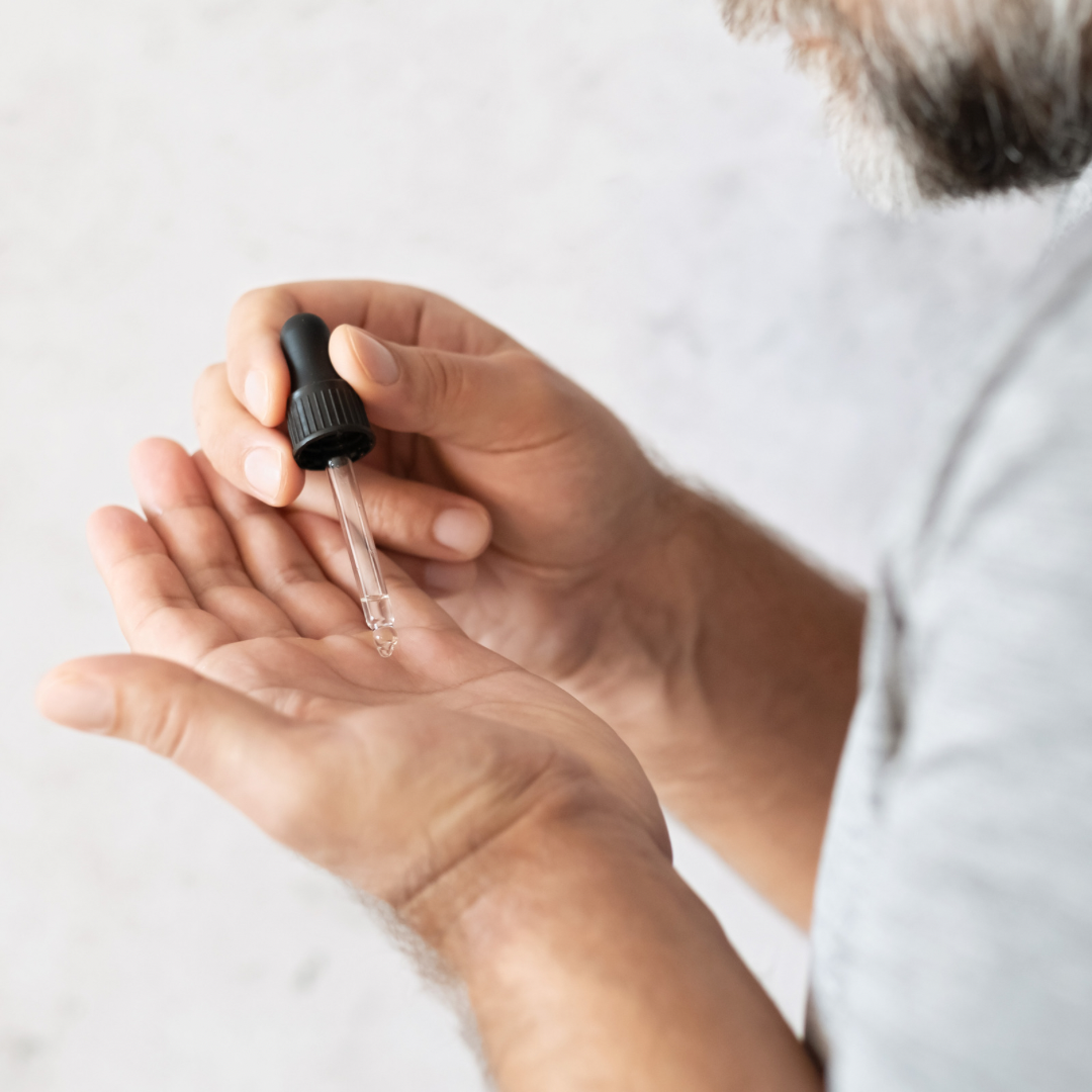 Man putting beard oil in hands